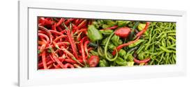 Close-Up of Green and Red Chili Peppers at Market Stall-null-Framed Photographic Print