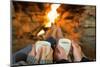 Close-Up of Hands Holding Coffee Cups in Front of Lit Fireplace-lightwavemedia-Mounted Photographic Print