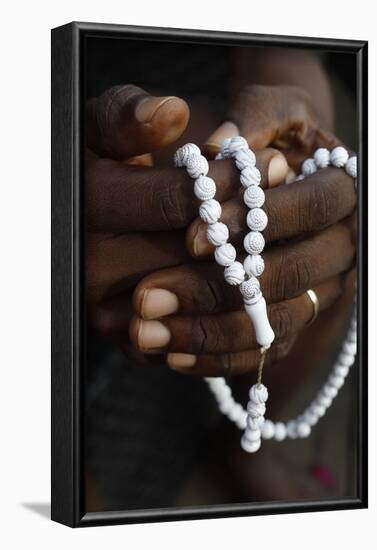 Close-up of hands of African Muslim man praying with Islamic prayer beads (tasbih), Togo-Godong-Framed Photographic Print