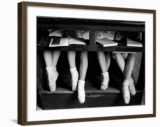 Close Up of Legs of Young Ballerinas in Toe Shoes under Desk at La Scala Ballet School-Alfred Eisenstaedt-Framed Photographic Print