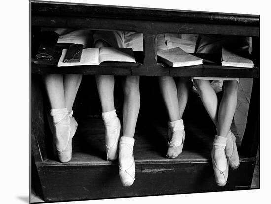 Close Up of Legs of Young Ballerinas in Toe Shoes under Desk at La Scala Ballet School-Alfred Eisenstaedt-Mounted Photographic Print