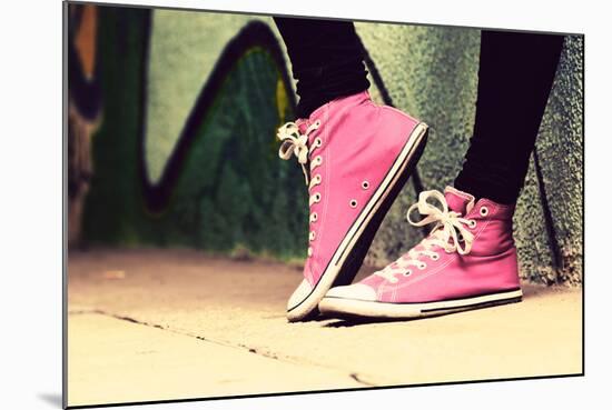 Close up of Pink Sneakers Worn by a Teenager. Grunge Graffiti Wall, Concepts of Teen Rebel, Problem-Michal Bednarek-Mounted Photographic Print