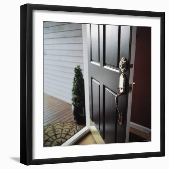 Close-up of the Front Door of a House Left Ajar-null-Framed Photographic Print