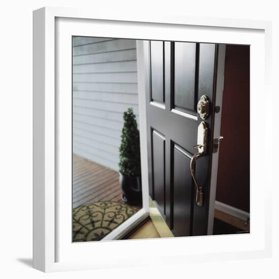 Close-up of the Front Door of a House Left Ajar-null-Framed Photographic Print