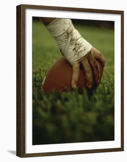 Close-up of the Hand of an American Football Player Holding a Football-null-Framed Premium Photographic Print