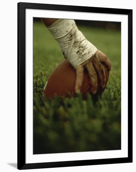 Close-up of the Hand of an American Football Player Holding a Football-null-Framed Photographic Print