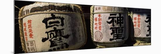 Close-up of Three Dedicated Sake Barrels, Imamiya Temple, Kita-Ku, Kyoto, Honshu, Japan-null-Mounted Photographic Print