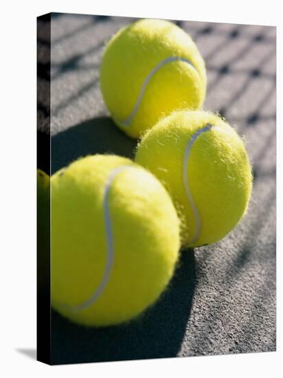 Close-up of Three Tennis Balls-null-Stretched Canvas