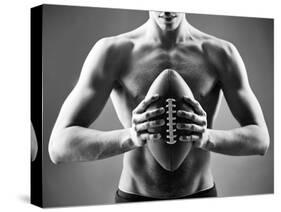 Close-Up of Topless Man Holding Rugby Ball in Isolation-pressmaster-Stretched Canvas