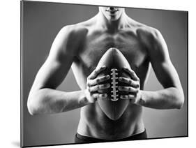 Close-Up of Topless Man Holding Rugby Ball in Isolation-pressmaster-Mounted Photographic Print