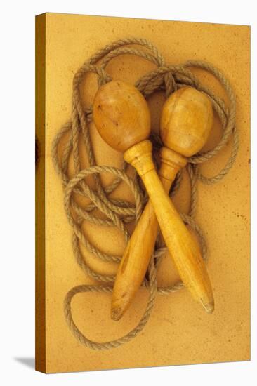 Close Up of Traditional Skipping Rope with Carved and Turned Wooden Handles Lying on Antique Paper-Den Reader-Stretched Canvas