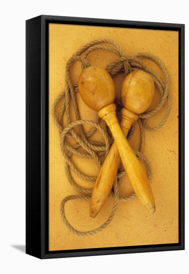 Close Up of Traditional Skipping Rope with Carved and Turned Wooden Handles Lying on Antique Paper-Den Reader-Framed Stretched Canvas