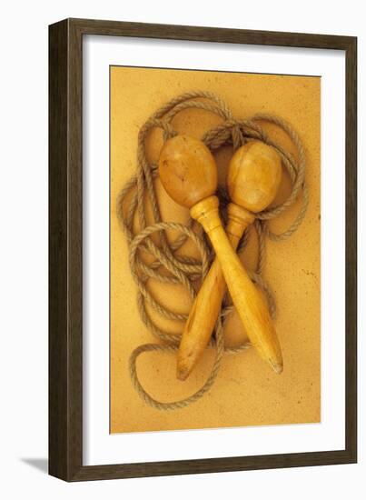 Close Up of Traditional Skipping Rope with Carved and Turned Wooden Handles Lying on Antique Paper-Den Reader-Framed Photographic Print