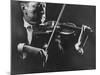 Close Up of Violinist Jascha Heifetz Playing in Mili's Darkened Studio-Gjon Mili-Mounted Premium Photographic Print