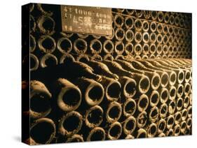 Close-up of Wine Bottles in a Cellar of Bollinger, Ay, Champagne, France-null-Stretched Canvas