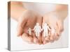 Close Up of Womans Cupped Hands Showing Paper Man Family-dolgachov-Stretched Canvas