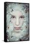 Close Up of Young Girls Face in Flowers-Carolina Hernandez-Framed Stretched Canvas