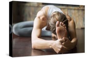 Close up of Young Woman Practicing Yoga, Sitting in Head to Knee Forward Bend Exercise, Janu Sirsas-fizkes-Stretched Canvas