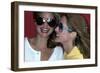 Close-Up on Two Models with Smiles, a Pair of Red Plastic Bon-Lon Sunglasses by Bonneau-Jacques Malignon-Framed Premium Giclee Print
