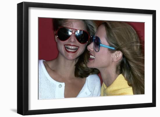 Close-Up on Two Models with Smiles, a Pair of Red Plastic Bon-Lon Sunglasses by Bonneau-Jacques Malignon-Framed Premium Giclee Print
