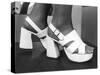 Close-Up Photograph of Feet in a Pair of White Platform Sandals-null-Stretched Canvas