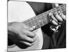 Close Up Shot of Musician Leadbelly, aka Huddie Ledbetter's Hands While Playing Acoustic Guitar-Bernard Hoffman-Mounted Premium Photographic Print