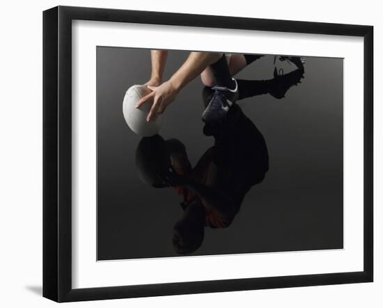 Closeup Low Section and Reflection of a Rugby Player Kneeling on One Knee with Ball-Nosnibor137-Framed Photographic Print