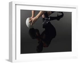 Closeup Low Section and Reflection of a Rugby Player Kneeling on One Knee with Ball-Nosnibor137-Framed Photographic Print