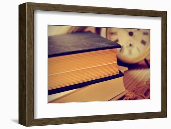 Closeup of a Pile of Old Books and an Old Alarm Clock on a Desk, with a Retro Effect-nito-Framed Photographic Print