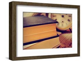 Closeup of a Pile of Old Books and an Old Alarm Clock on a Desk, with a Retro Effect-nito-Framed Photographic Print