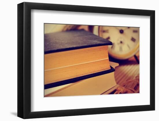 Closeup of a Pile of Old Books and an Old Alarm Clock on a Desk, with a Retro Effect-nito-Framed Photographic Print