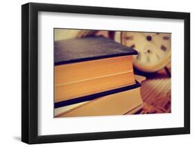 Closeup of a Pile of Old Books and an Old Alarm Clock on a Desk, with a Retro Effect-nito-Framed Photographic Print