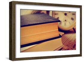 Closeup of a Pile of Old Books and an Old Alarm Clock on a Desk, with a Retro Effect-nito-Framed Photographic Print