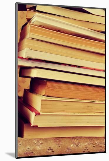 Closeup of a Piles of Books, with a Retro Effect-nito-Mounted Photographic Print