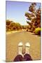 Closeup of the Feet of a Man Lying down on a Road-nito-Mounted Premium Photographic Print