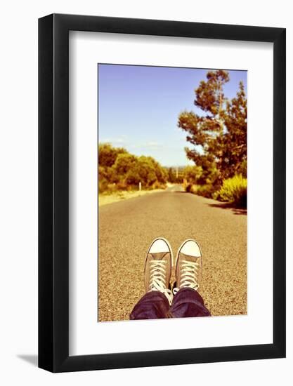 Closeup of the Feet of a Man Lying down on a Road-nito-Framed Photographic Print