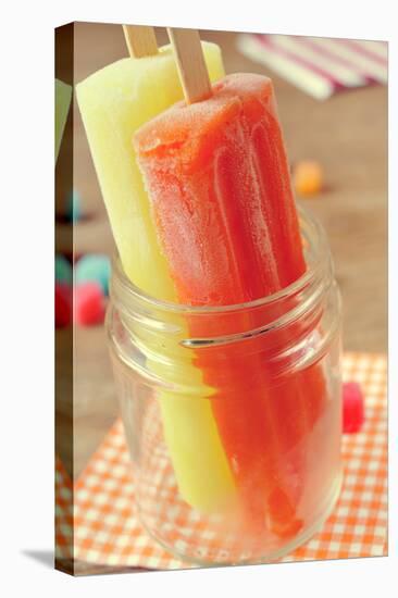 Closeup of Two Appetizing Ice Pops of Different Flavors in a Glass Jar-nito-Stretched Canvas