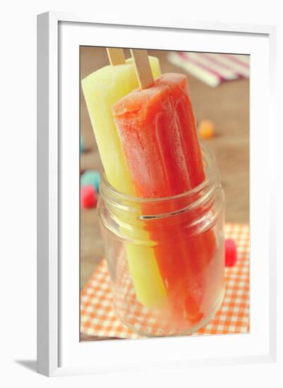 Closeup of Two Appetizing Ice Pops of Different Flavors in a Glass Jar-nito-Framed Photographic Print