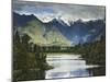 Cloud-Shrouded Mt. Cook Reflected in Lake Matheson, Near Town of Fox Glacier, South Island-Dennis Flaherty-Mounted Photographic Print