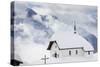 Clouds Above the Mountain Huts and Church Covered with Snow, Bettmeralp, District of Raron-Roberto Moiola-Stretched Canvas