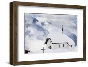 Clouds Above the Mountain Huts and Church Covered with Snow, Bettmeralp, District of Raron-Roberto Moiola-Framed Photographic Print