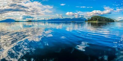 https://imgc.allpostersimages.com/img/posters/clouds-and-sky-reflected-in-the-calm-waters-of-the-inside-passage-southeast-alaska-usa_u-L-Q1BVCKZ0.jpg?artPerspective=n
