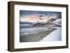 Clouds at sunset over mountain peak covered with snow and icy Skagsanden beach, Flakstad-Roberto Moiola-Framed Photographic Print