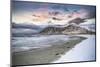 Clouds at sunset over mountain peak covered with snow and icy Skagsanden beach, Flakstad-Roberto Moiola-Mounted Photographic Print