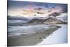 Clouds at sunset over mountain peak covered with snow and icy Skagsanden beach, Flakstad-Roberto Moiola-Stretched Canvas