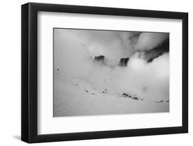 Clouds hang between the mountains of the Dolomites-Jean Schwarz-Framed Photographic Print