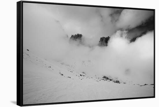 Clouds hang between the mountains of the Dolomites-Jean Schwarz-Framed Stretched Canvas