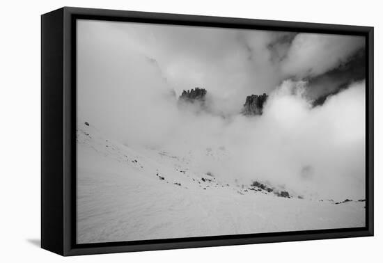 Clouds hang between the mountains of the Dolomites-Jean Schwarz-Framed Stretched Canvas