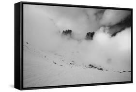 Clouds hang between the mountains of the Dolomites-Jean Schwarz-Framed Stretched Canvas