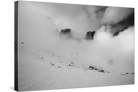 Clouds hang between the mountains of the Dolomites-Jean Schwarz-Stretched Canvas